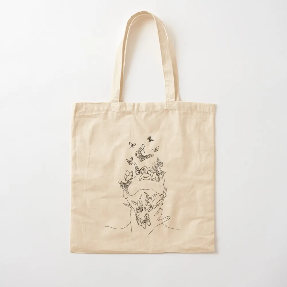 Abstract face with butterfly by one line drawing. Portrait minimalistic style. Botanical print. Nature symbol of cosmet Tote Bag