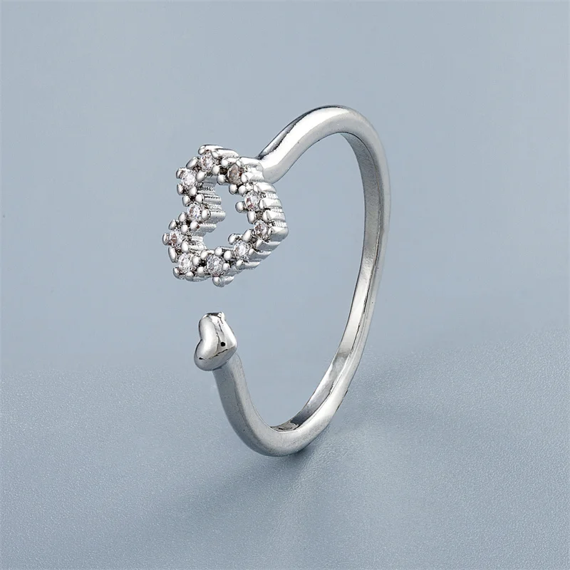 QMCOCO  Silver Color Hollow Out Heart-Shape Fashion Temperament Sweet Personality Trend Resizable Rings For Women Gifts