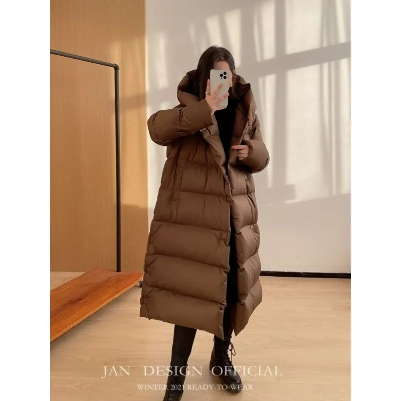 2025 Nowy styl długa, do kolan, pogrubiona kurtka z kapturem z białego kaczego puchu, luźna, wysokiej klasy kurtka na zimę, ciepła, prosta kurtka puchowa