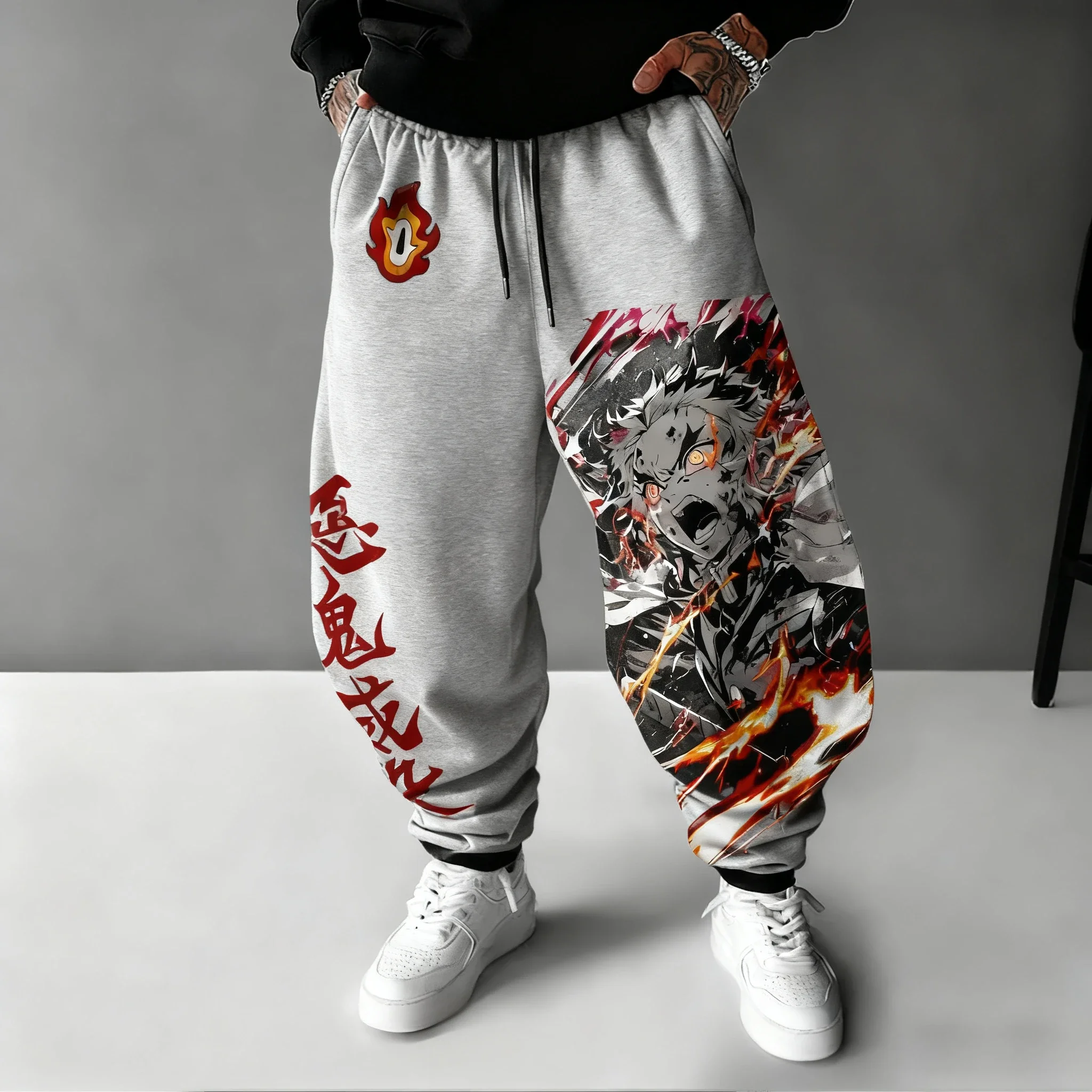 Demon Slayer Anime hombre 2026 Otoño/Invierno pantalones deportivos Rengoku Kyoujurou estampado dibujado a mano deportes Casual moda pantalones ajustados