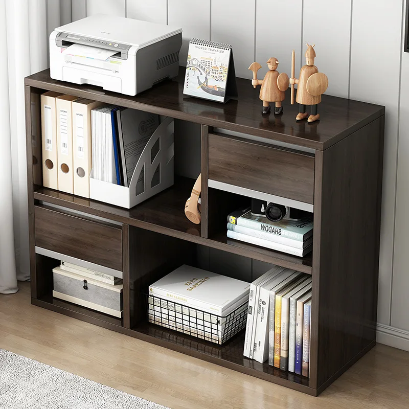 Floor-to-ceiling storage: The living room relies on storage and layered shelves, simple low bookcases