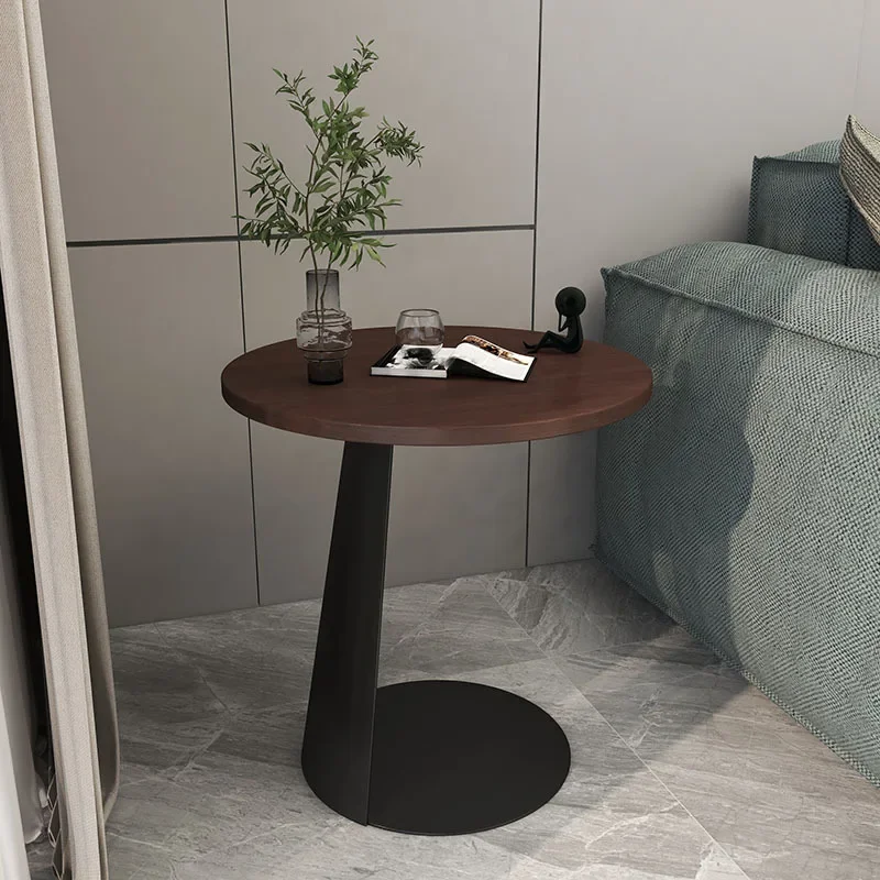 

sofas with solid wood edges, a small round table, a balcony, and a small C-shaped coffee table with