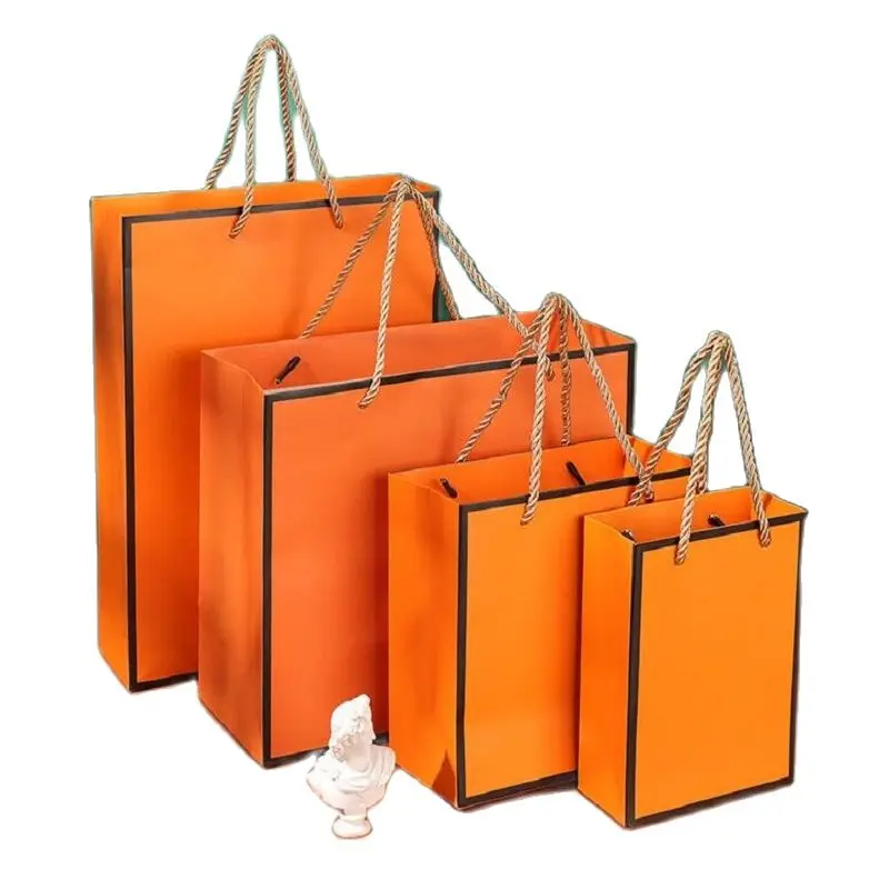 New Eco Friendly Custom Orange Paper Bag with Handle for Shopping Clothes Shoes Store Gift Packaging Bag Wedding Party Favor