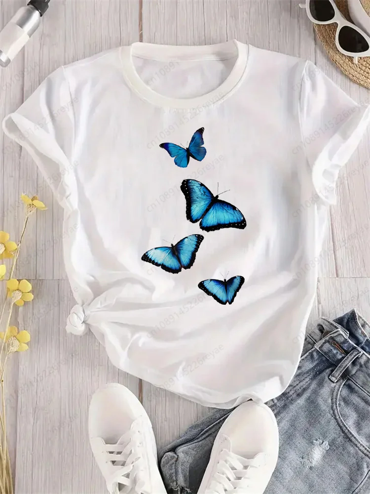 Camiseta de mariposa azul con flores voladoras para mujer, camiseta deportiva elegante con estampado, transpirable, ajuste cómodo, parte superior blanca perfecta para todas las estaciones