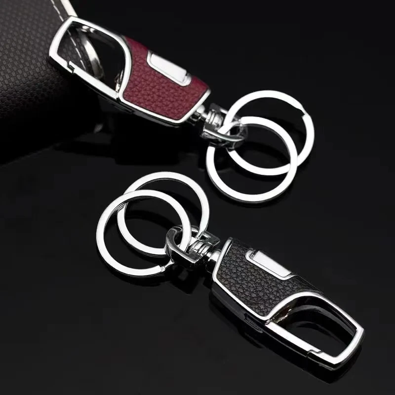 Porte-clés en métal à double anneau, simple et élégant. Texture épaisse et robuste, anti-perte et portable, reflétant le goût masculin.