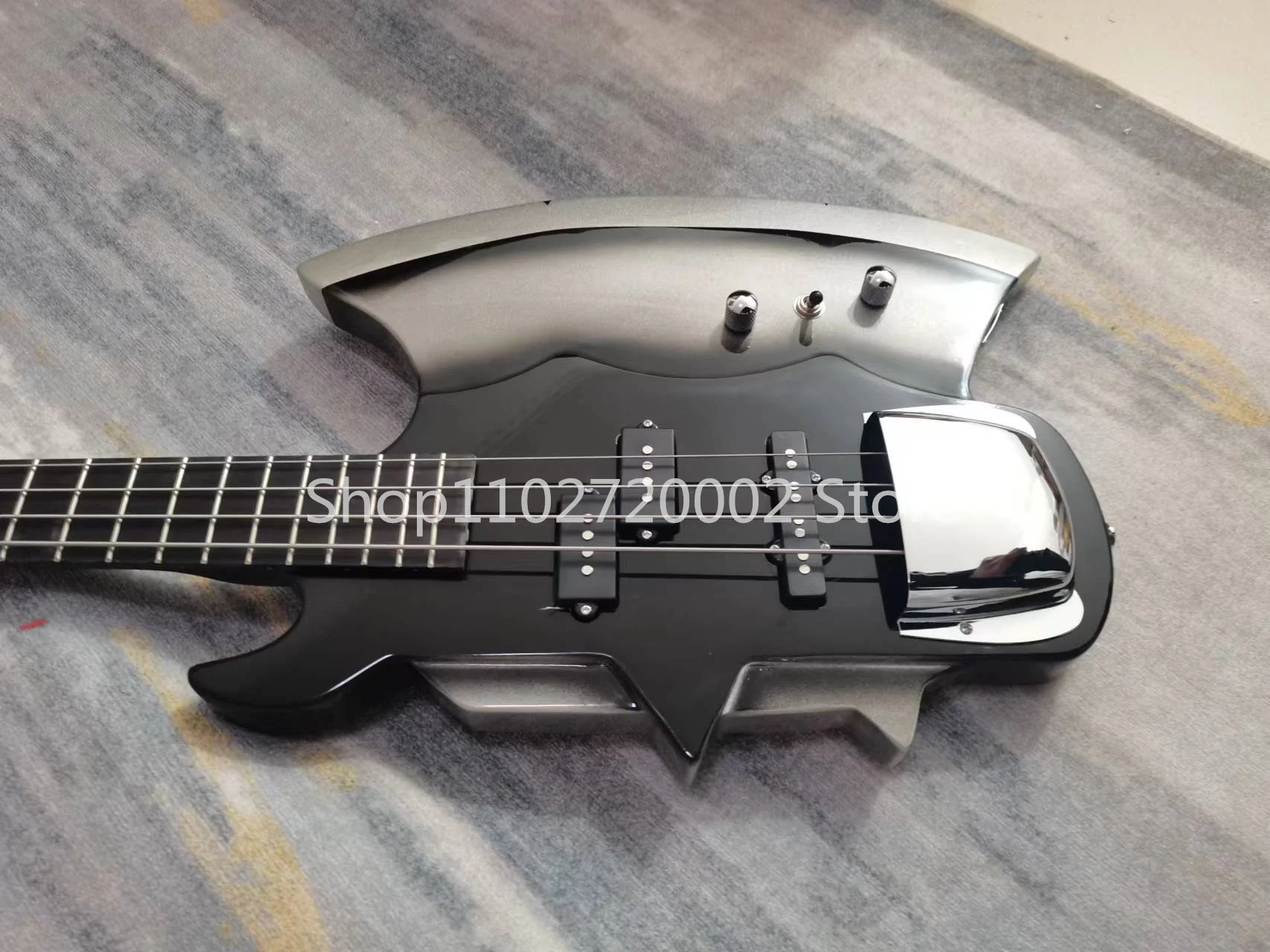 4-string axe bass guitar, rosewood fingerboard, fixed bridge, silver accessories, seller to bear shipping costs