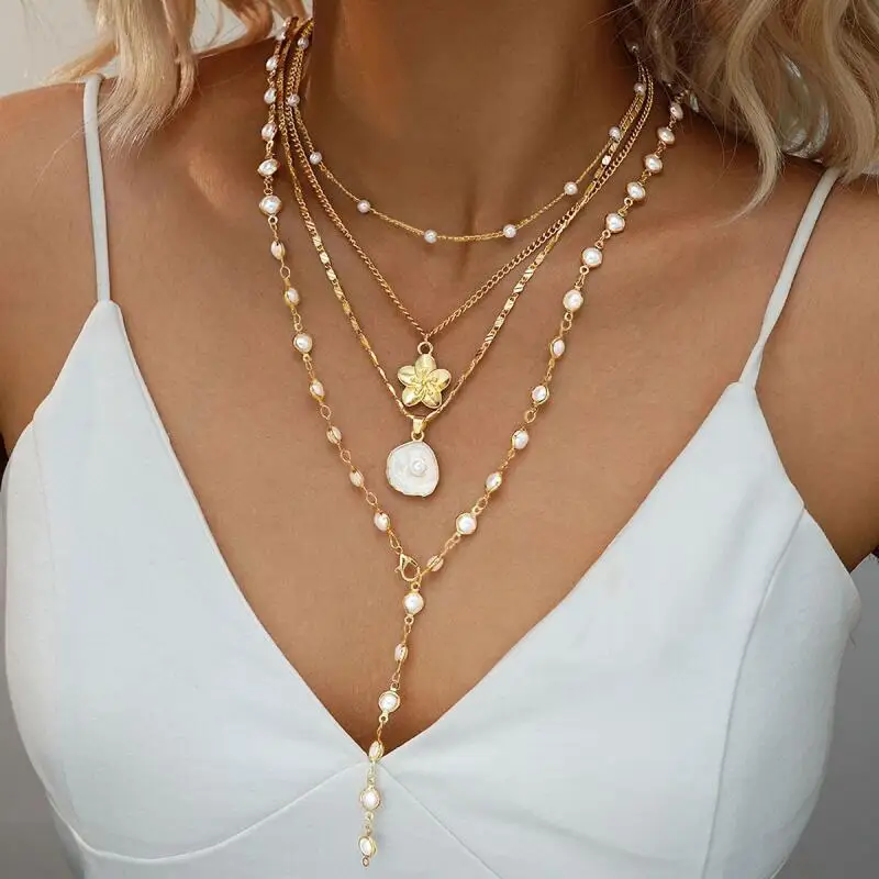 

4-piece set of women's gold necklace, flower pendant, pearl layered necklace, fashionable retro French long sweater chain