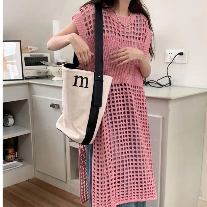 Vestido suéter feminino de malha em camadas cor sólida oco solto sem mangas colete vestido em torno do pescoço estilo viajante vestido 2025 novo