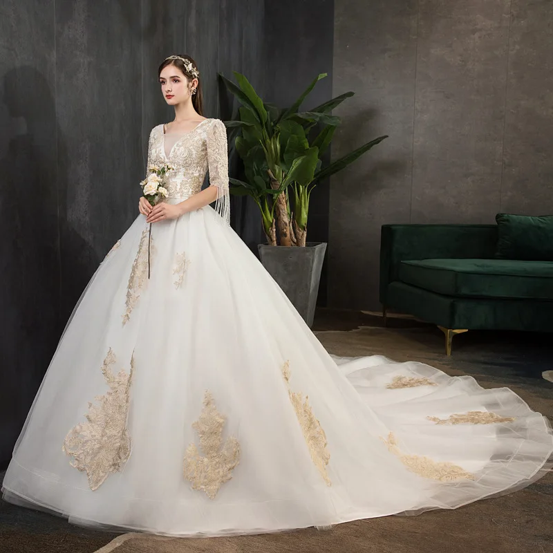 

Customized Luxury Lace Wedding Dress V-Neck Half Sleeve Beaded Tassel Fan-Back Tulle Bridal Ball Gown with Lace-Up Back