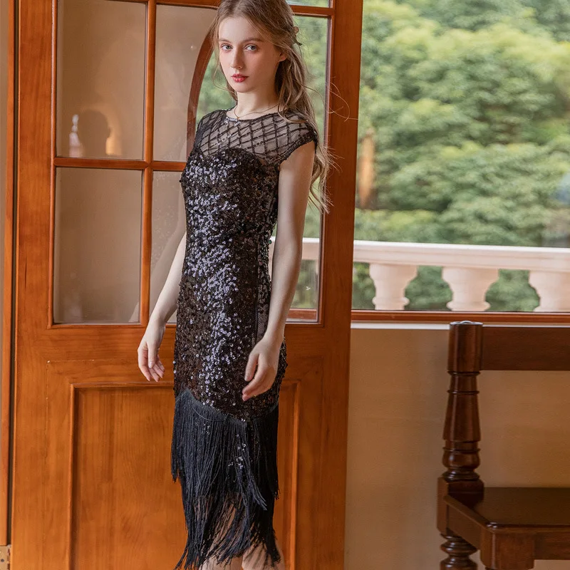 Abito femminile sexy con frange di paillettes O-Collo senza maniche Vedi attraverso la maglia aderente Abito con nappe stanche Abito da banchetto per feste con glitter