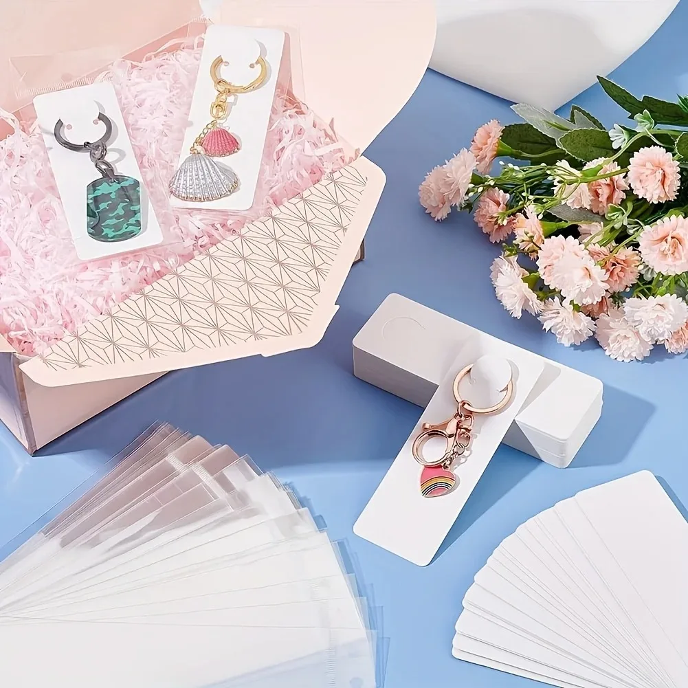 200-Pc Keychain Display Kit: Retail-Ready with 100 Recyclable Cards & 100 Clear Bags. Pre-Cut Holes for Boutiques & Trade Shows.