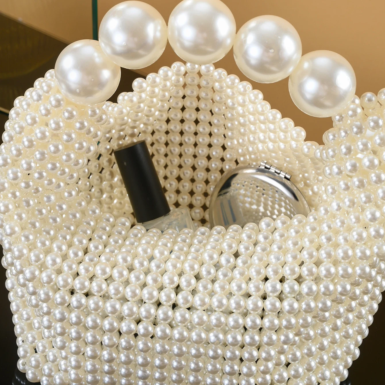 European and American style new beaded handbag Summer women\'s pearl bag hand woven wrist bag Fashion temperament handbag