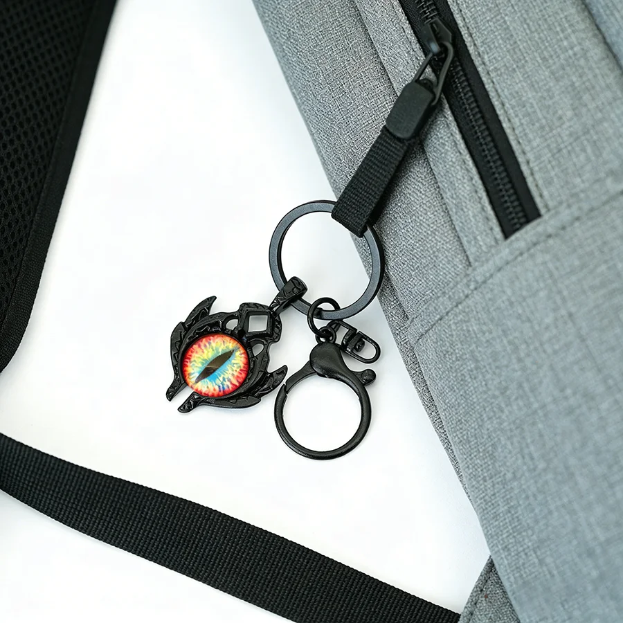Noter Neuer einzigartiger Schlüsselanhänger mit bösen Augen für Männer und Frauen, 4 Farben erhältlich, Rucksack-Auto-Charm-Anhänger, dekoratives, vielseitiges Zubehör