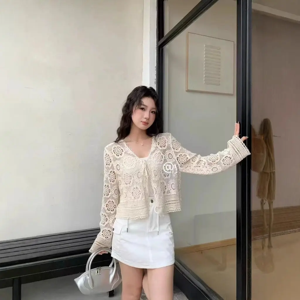 

Women's Seaside Holiday Style Hollow-out Knit Sweater V-neck Tassel Lace-up Micro-transparent Sunscreen Top Trendy Spring