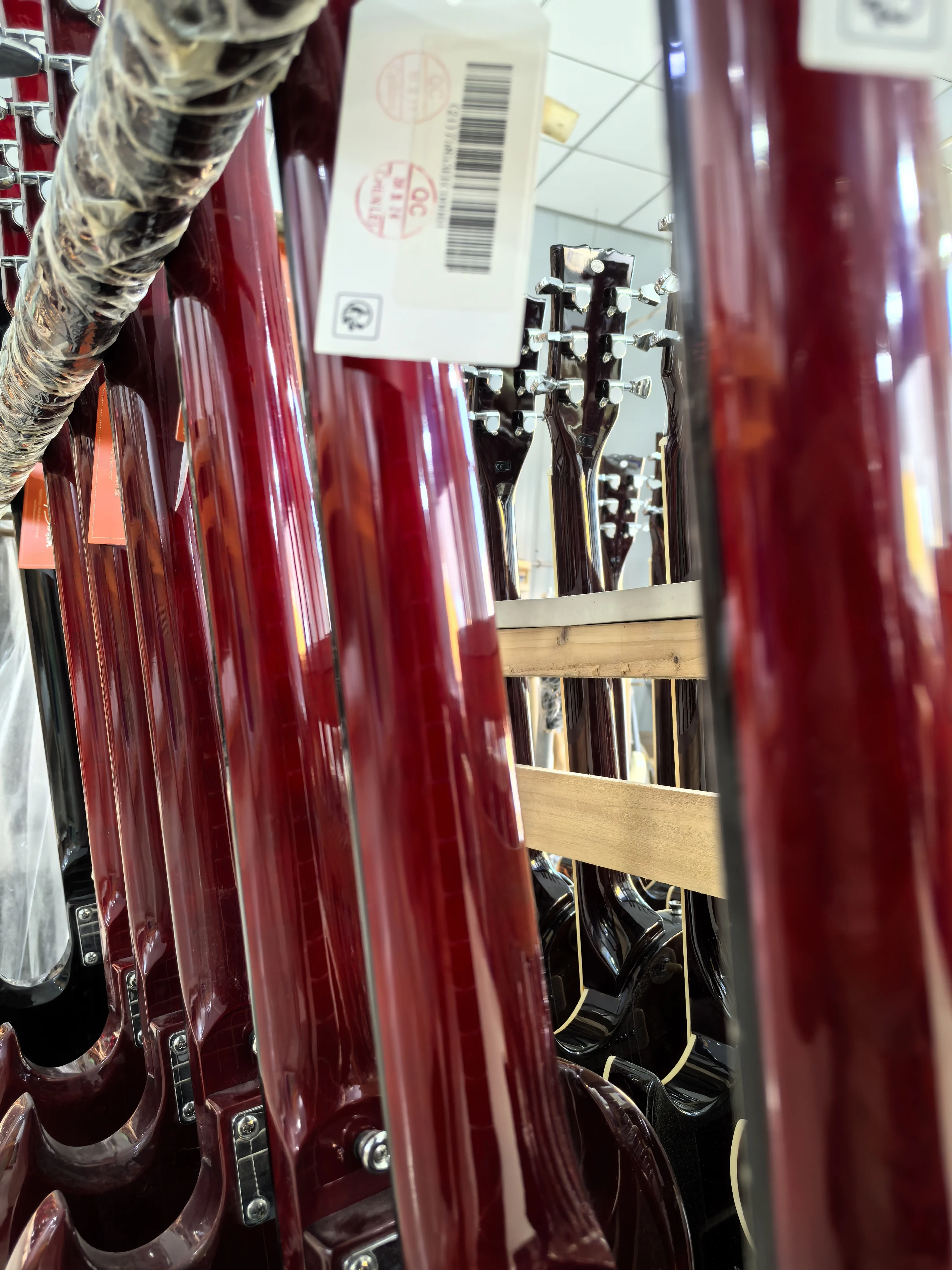 Customizable, wine red 6 string electric guitar, split joint, Augustan body, Augustan head, in stock.