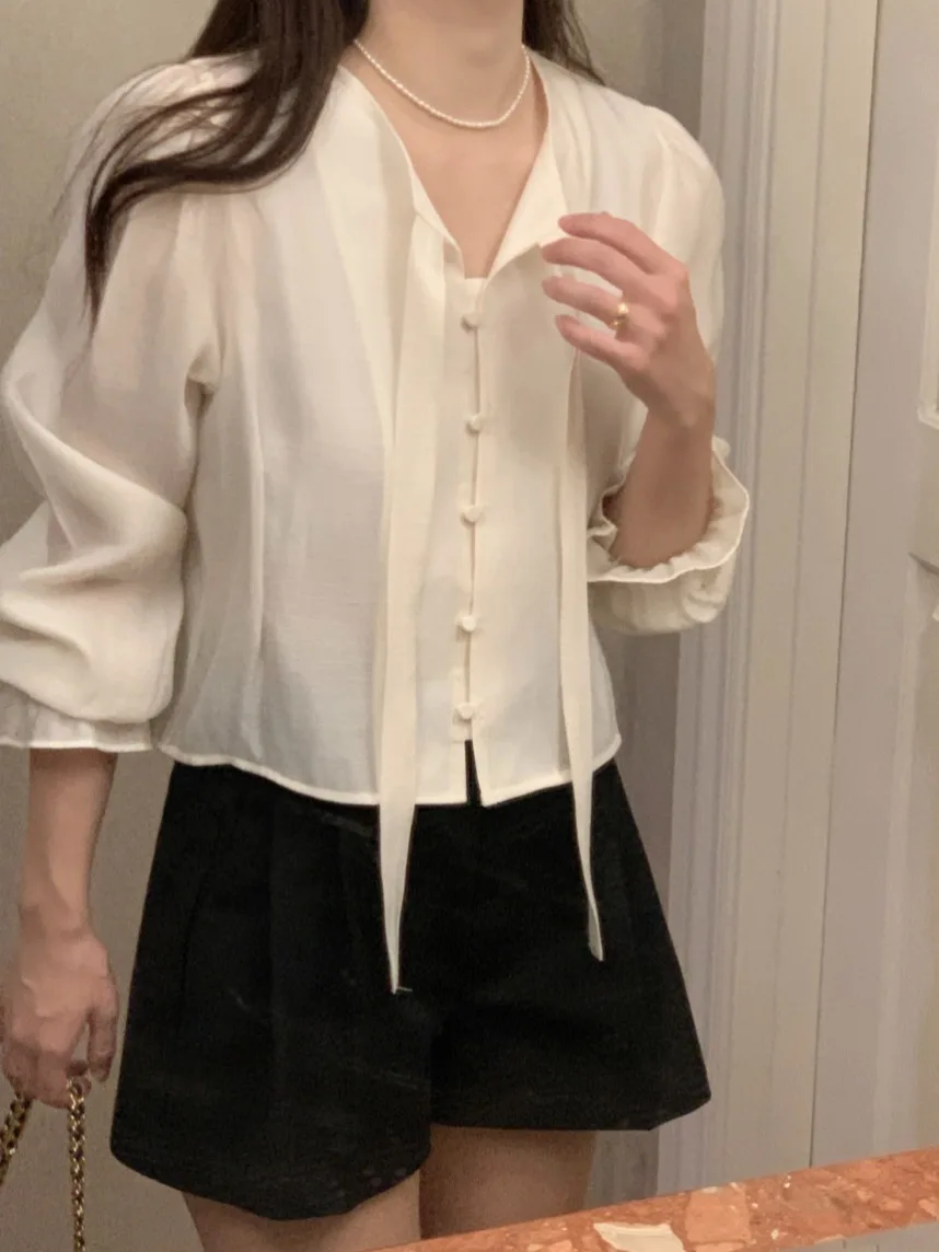 تصميم كوري للنساء ort Sve irt ربيع 2025 جديد Sweet Ele Faionable Bell Sve Top Commute Sle Pure E-commerce