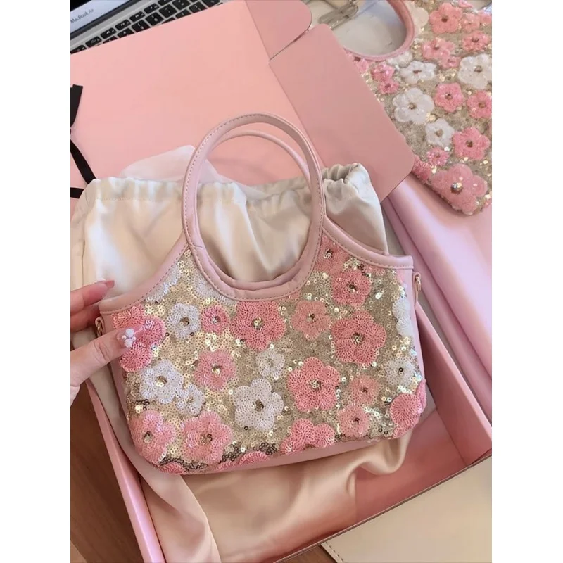 Bolso tote mini estilo coreano 2026 en rosa pastel con flores de lentejuelas, ideal para principios de primavera, bolso cruzado versátil informal