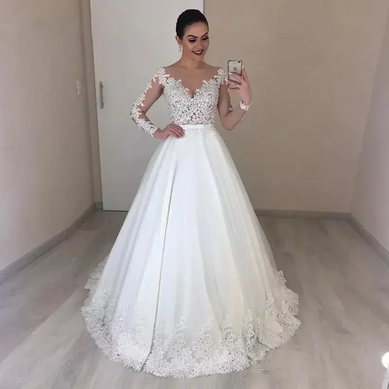 New African Ball Gown Wedding Dresses Jewel Neck Illusion Lace Appliques Beaded Long Sleeves Sweep Train Plus Size Formal Bridal