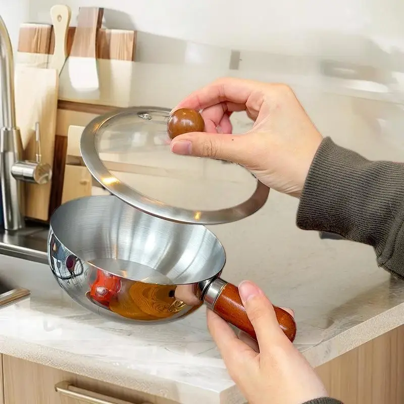 وعاء من الفولاذ المقاوم للصدأ لشخص واحد مع مقبض من خشب الجوز لسلطة الفاكهة، وأدوات المطبخ للمطعم