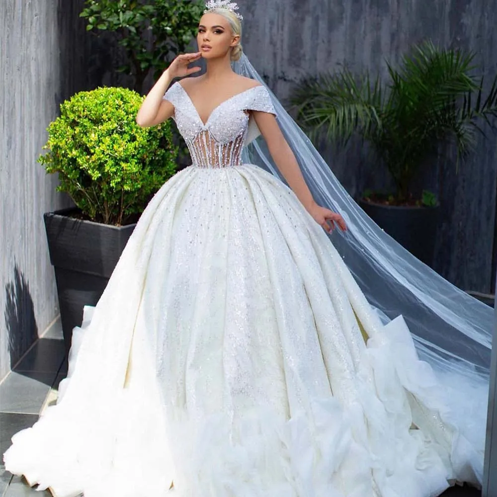 

Gorgeous V Neck See Through Crystals Beads Ballgown Vestido De Casamento Backless Saudi Arabic Garden Puffy Bridal Gowns