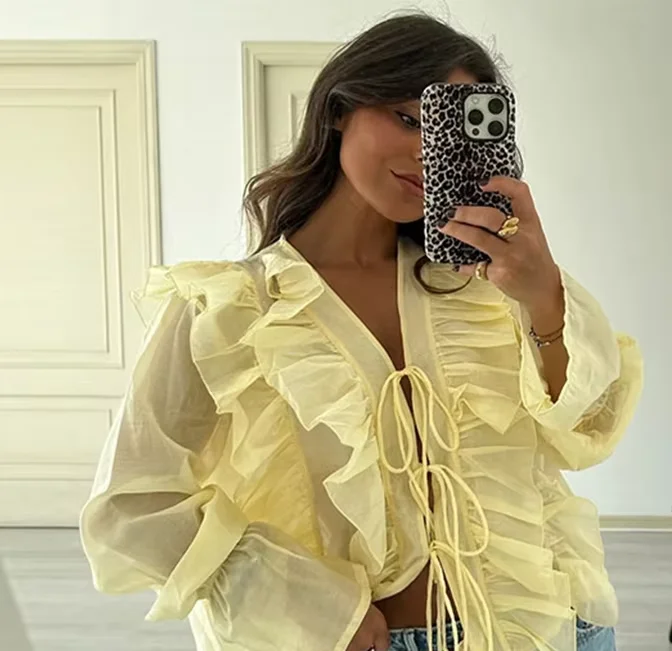 

Elegant Casual Tops For Women Ruffled Flare Sleeve Lace Up Draped Half Transparent Blouses 2025 Summer Female Solid Outerwear