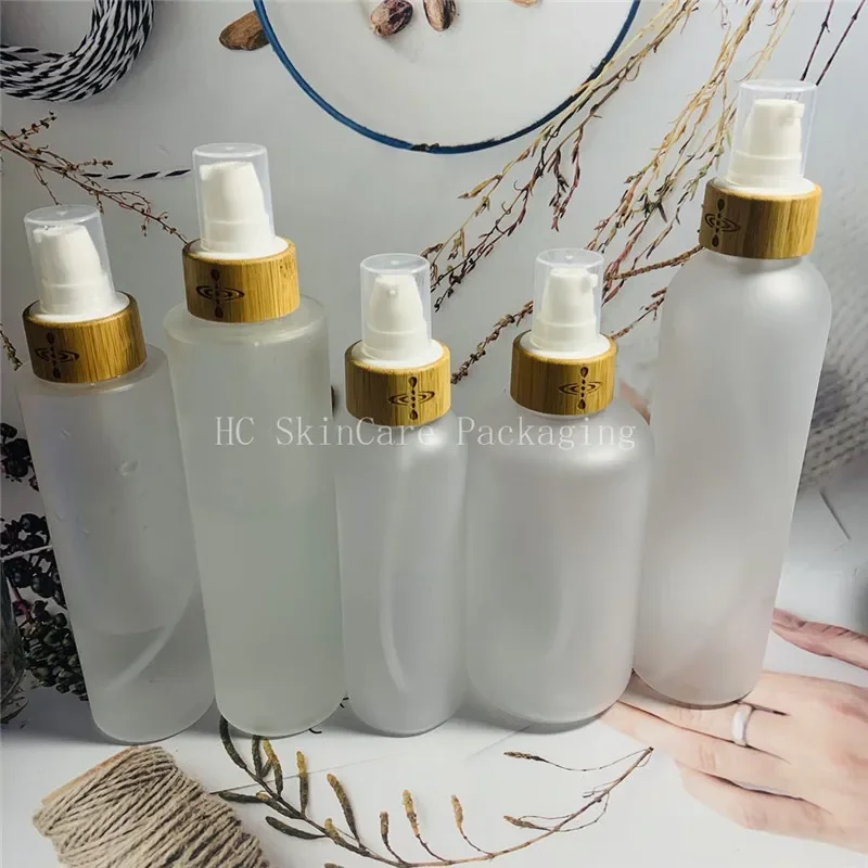 

shampoo bottles wholesale transparent frosted plastic bottle with bamboo lid empty cosmetic containers bulk，costemic bottle