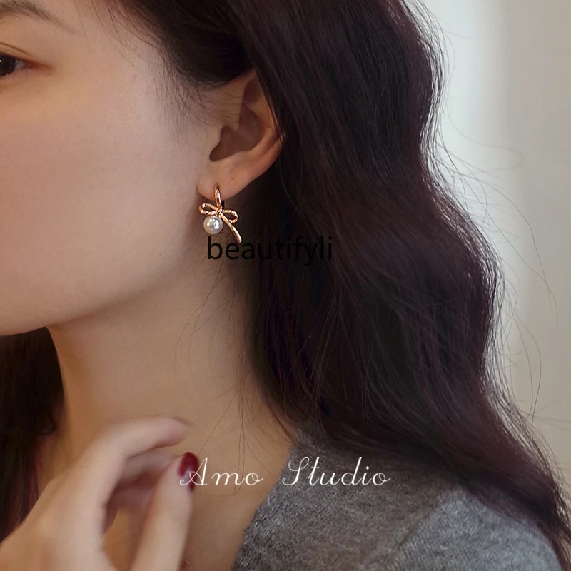 

Ballet style bow pearl earrings women's niche unique sweet girl gentle earrings