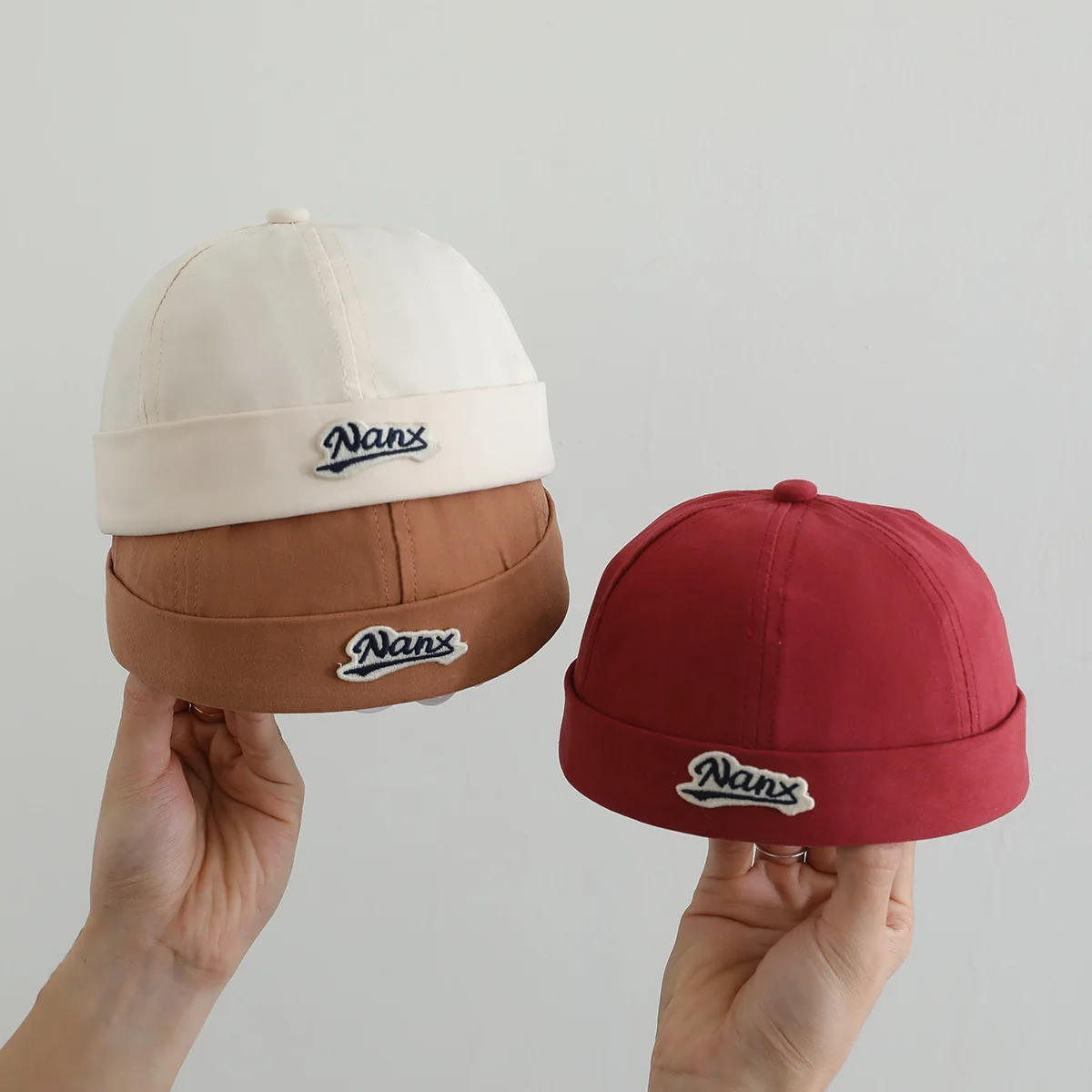 2025 ฤดูใบไม้ผลิฤดูร้อนใหม่ Docker หมวกเด็กชายหญิง Brimless หมวกเย็บปักถักร้อยหมวกน่ารัก