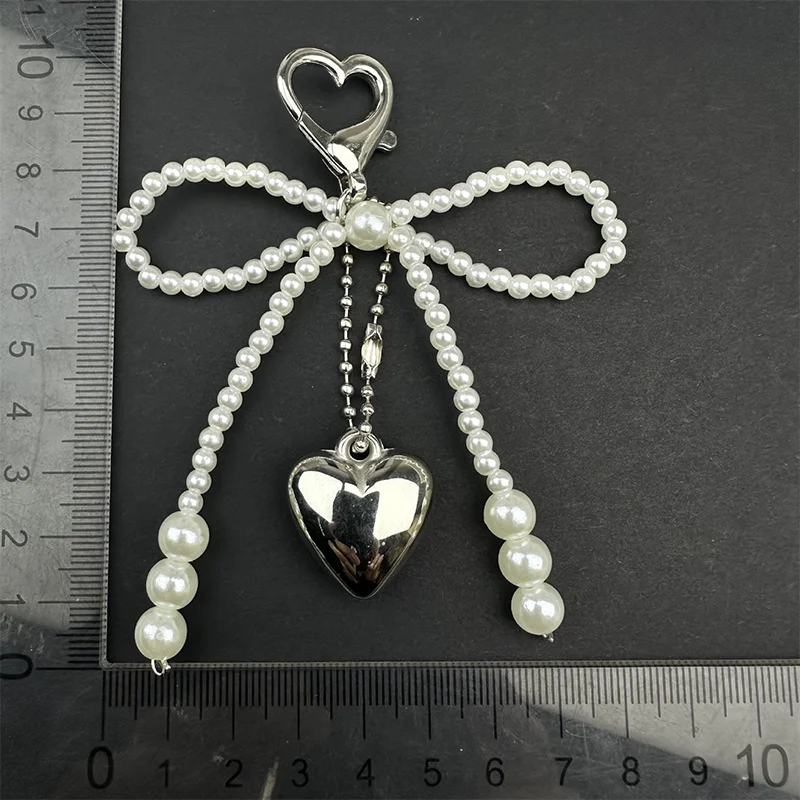 حقيبة جديدة على شكل فيونكة لؤلؤية على شكل قلب مصنوعة يدويًا لحقيبة الهاتف وحقيبة الملابس والأحذية وإكسسوارات الحقائب