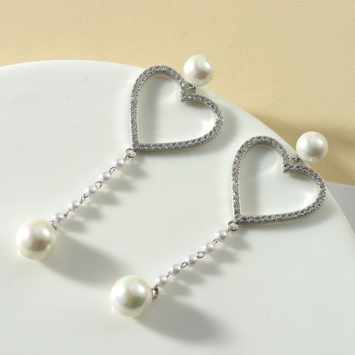 Geometric earrings - heart-shaped, made of 925 silver, with tiny inlaid zirconia. Long style, Korean version, trendy ear jewelry