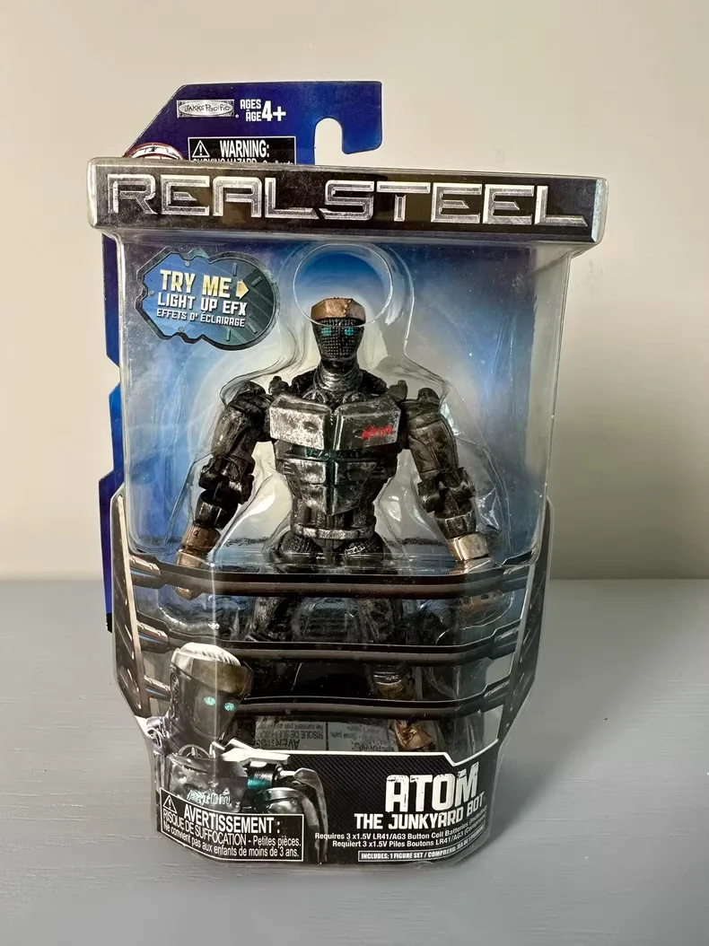 

Real Steel Atom Robot Figure Series 1 Scrap Mecha with Blue Light Effects, Articulated Joints, Unopened Original Packaging