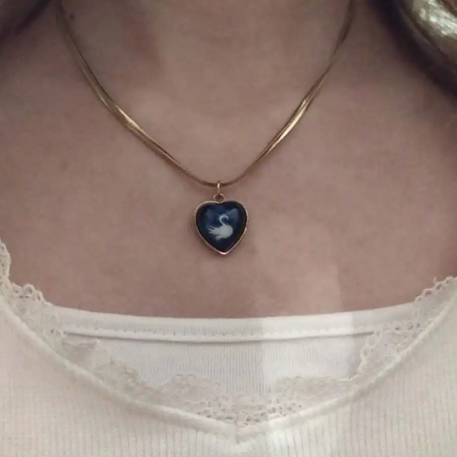 

Heart-Shaped Pendant Necklace with Swan Silhouette on Blue Resin, Silver-Tone Setting