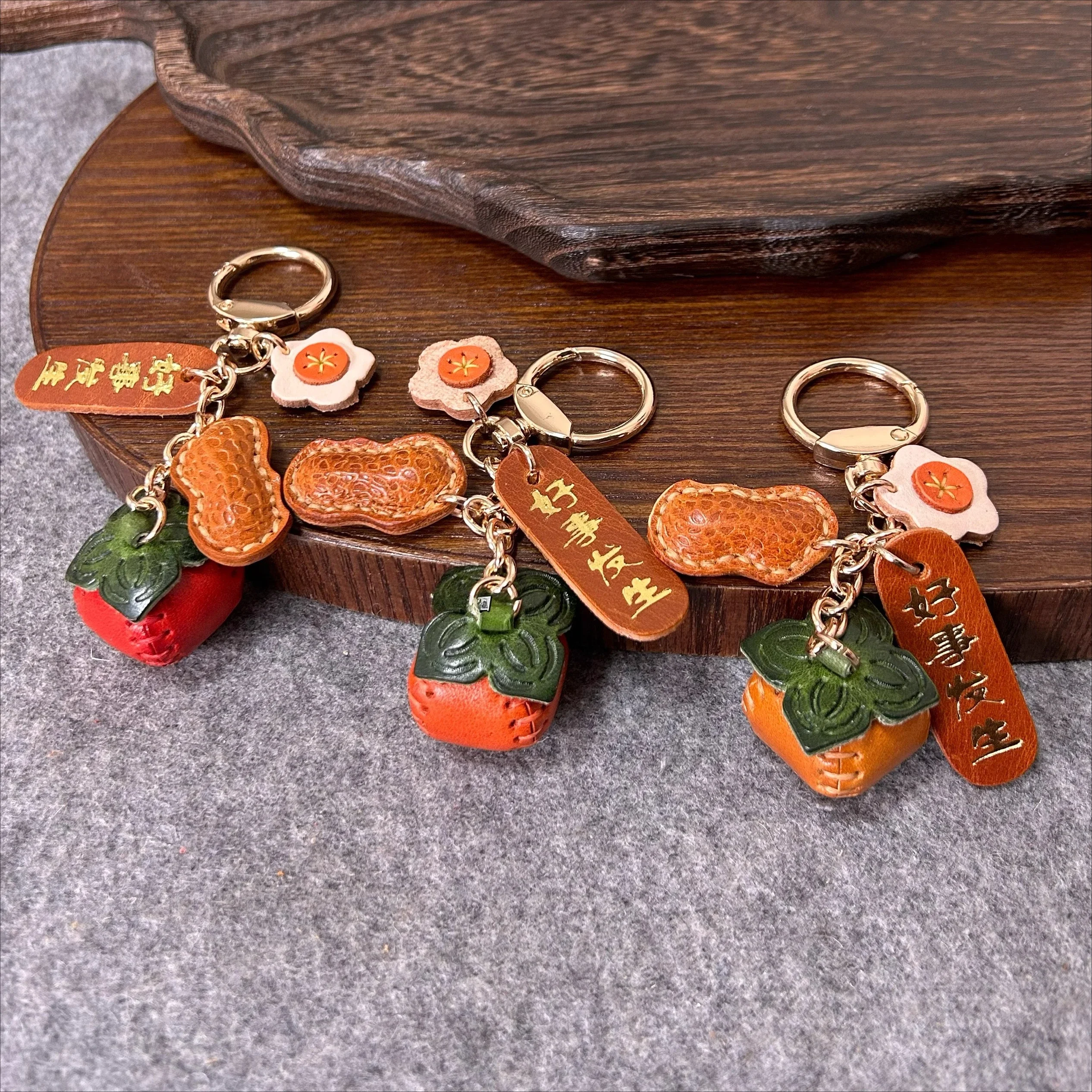 

The first layer of cowhide peanuts good persimmon pendant national style cowhide bag pendant key chain handbook bookmark gift
