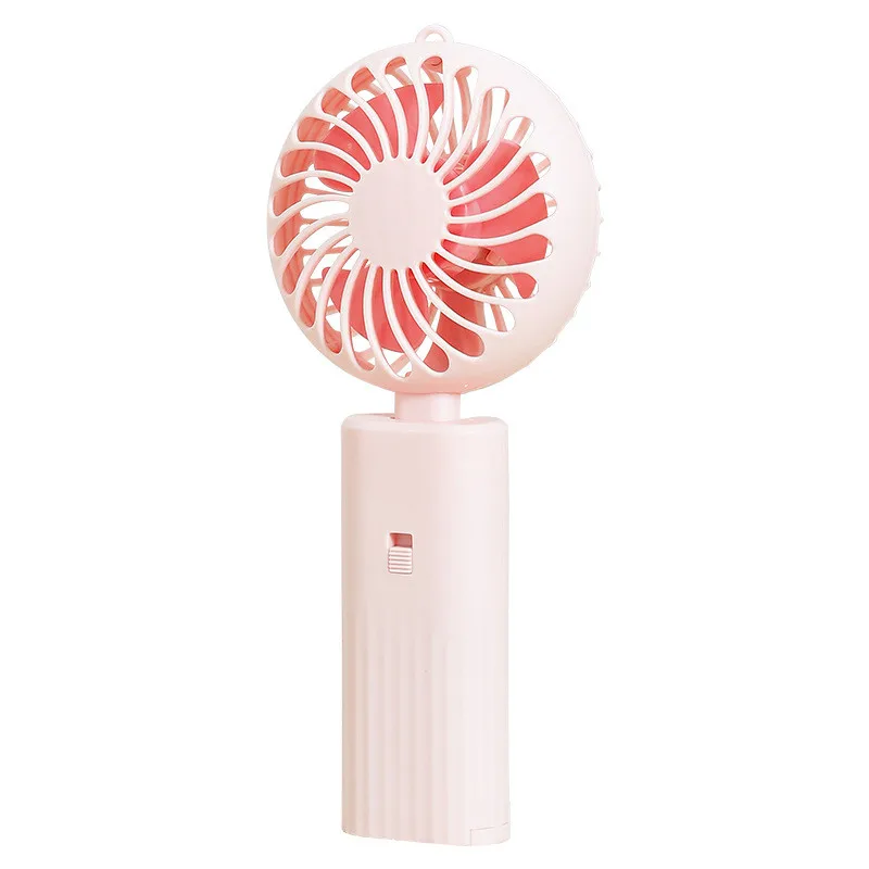 New foldable hand-held small fan Mini portable desktop fan Simple shape, strong wind speed, driven by two AA batteries