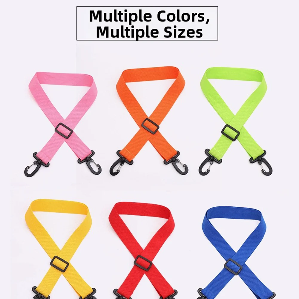 Non-tangle carrying strap with rotating clips ideal for transporting ski or skateboard pairs comfortably on shoulder or by hand