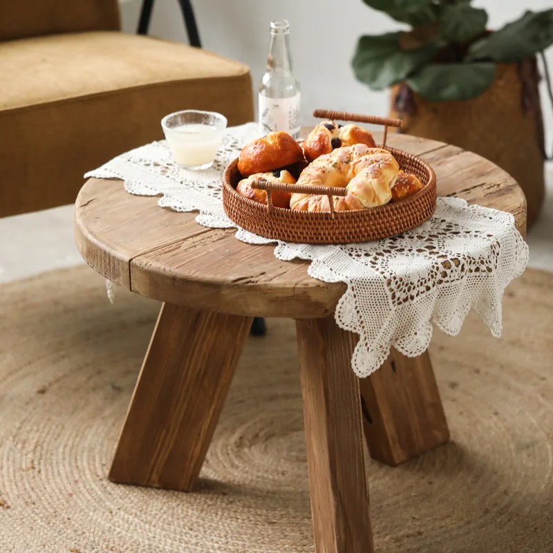 Wooden small round coffee table with a quiet breeze, old pine wood, round logs, creative retro design, and vintage home