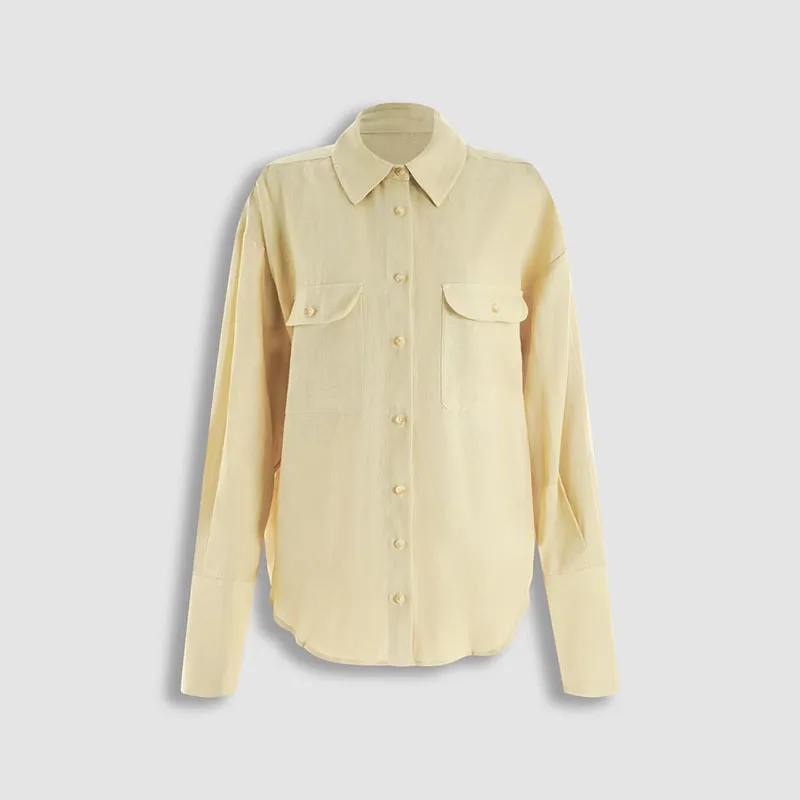 Women's collared long-sleeved blouse with double pockets and single button fastening, loose and casual for daily wear.