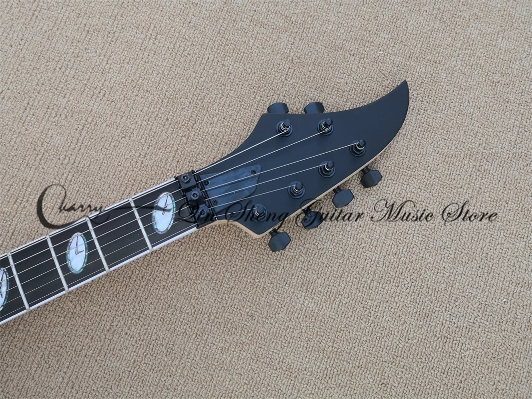 7-string electric guitar, matte mahogany body, maple wood, black tremolo bridge, two-track pickup