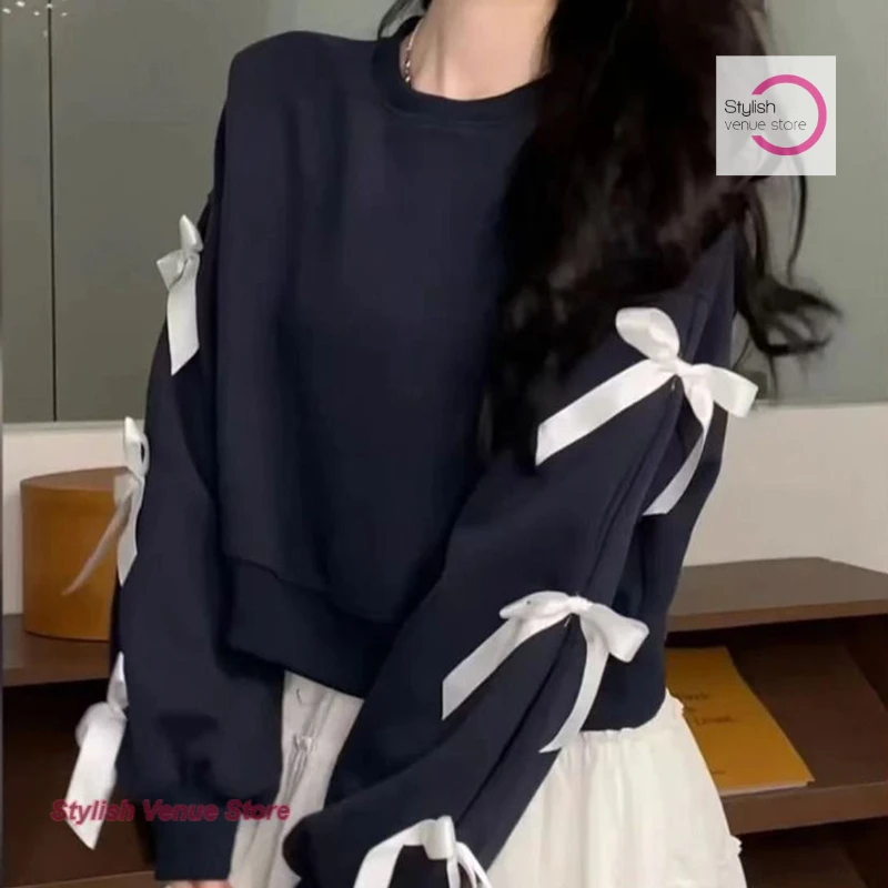 

Korean short bow long sleeve round neck sweater women's autumn and winter new loose design sweet and spicy short chic top.