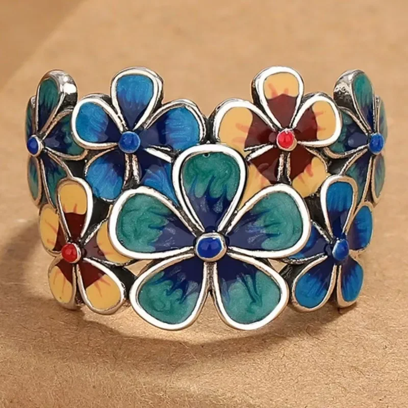 A retro-style hollowed-out blue lotus lock ring with a fashionable open ring featuring blue enamel craftsmanship