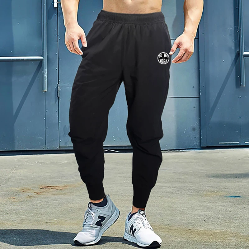 Muscleguys Fitness Running Training Sport Quick Dry Gym Bodybuilding Beam Mouth Casual Trousers with Pockets