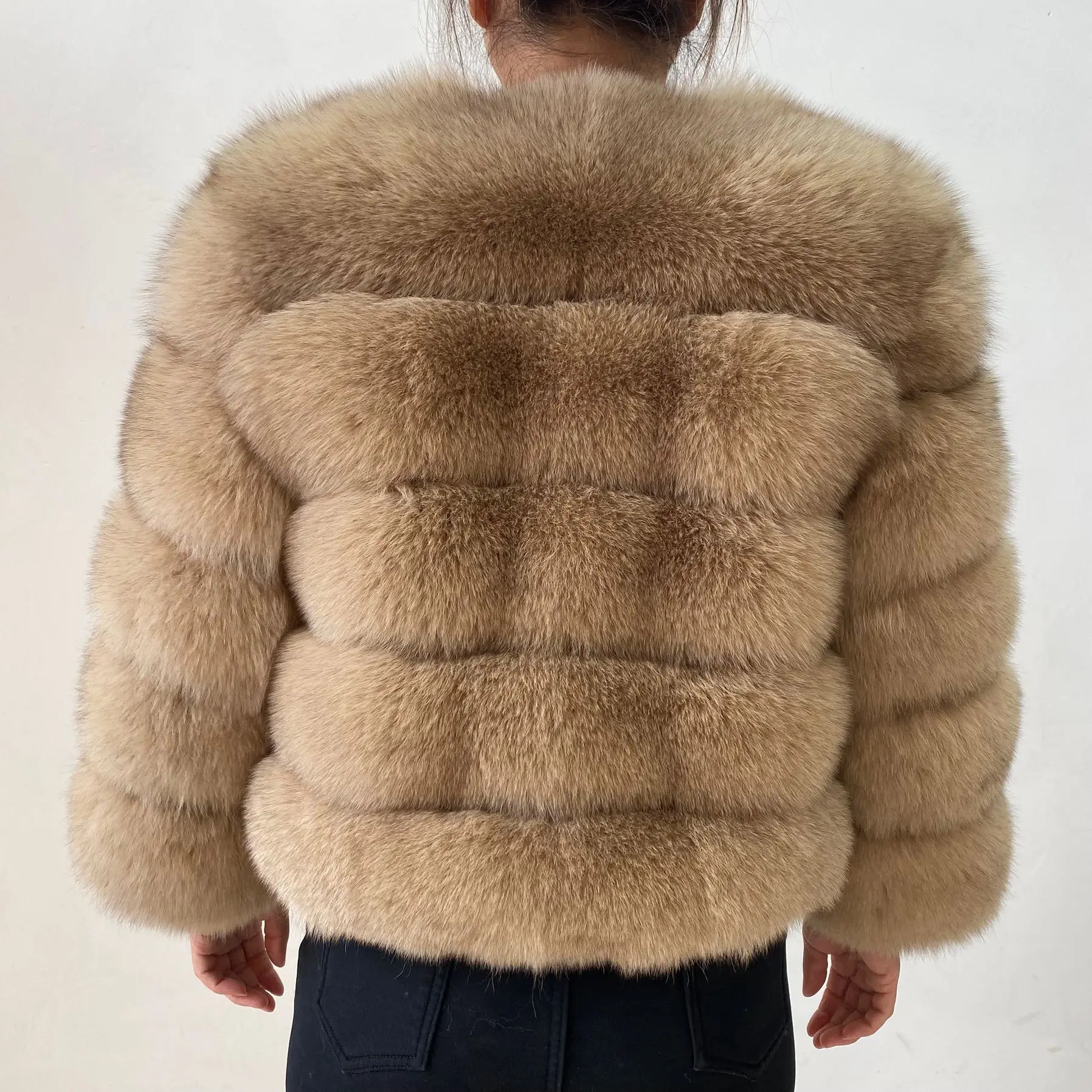 The lady's fashionable natural genuine fox fur women's winter fur coat. Fashionable fox fur natural fur women's coat. Genuine fo