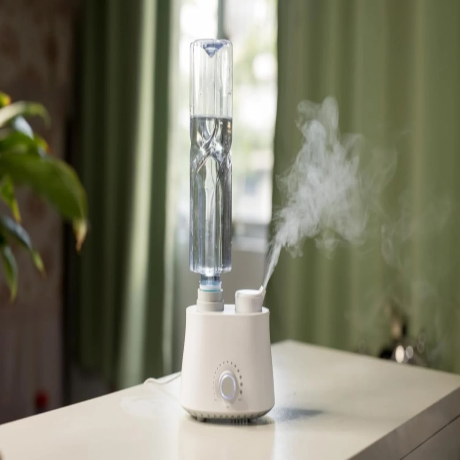 Convenient, portable, stylish white humidifier water bottle for bedroom, office, and hotel use. Adjustable, leak-proof design wi