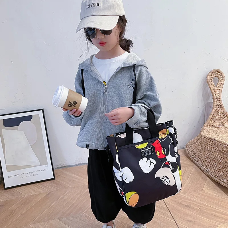 Bolso de mano de lona para estudiantes de primaria, Bolsa Escolar de gran capacidad con estampado de Mickey para niños y niñas