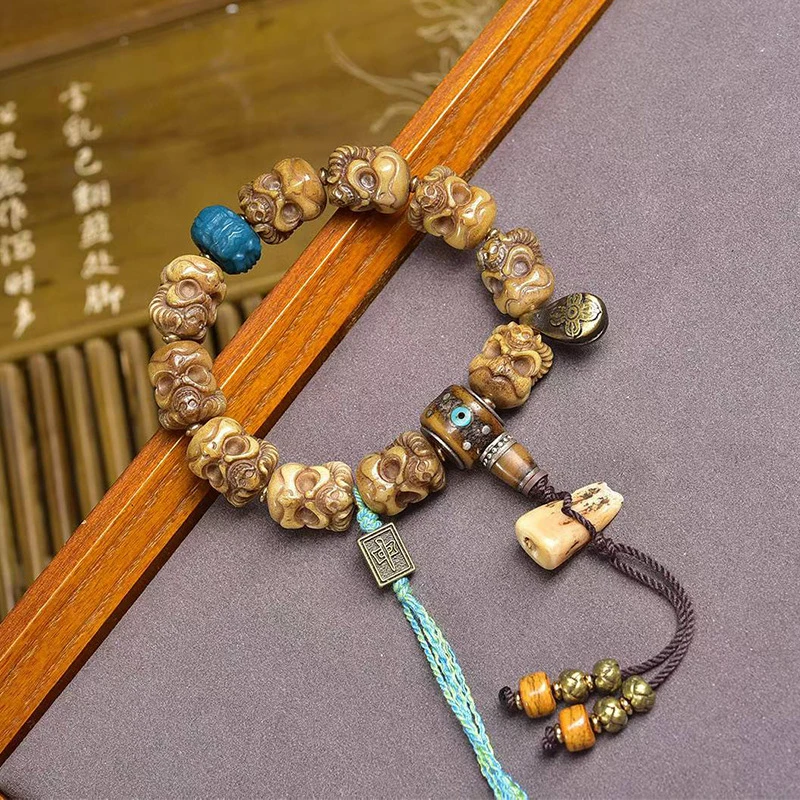 Hand-held Tibetan-style dice made from Yak bone with eighteen arhats and three-way connectors, used as an accessory a bracel