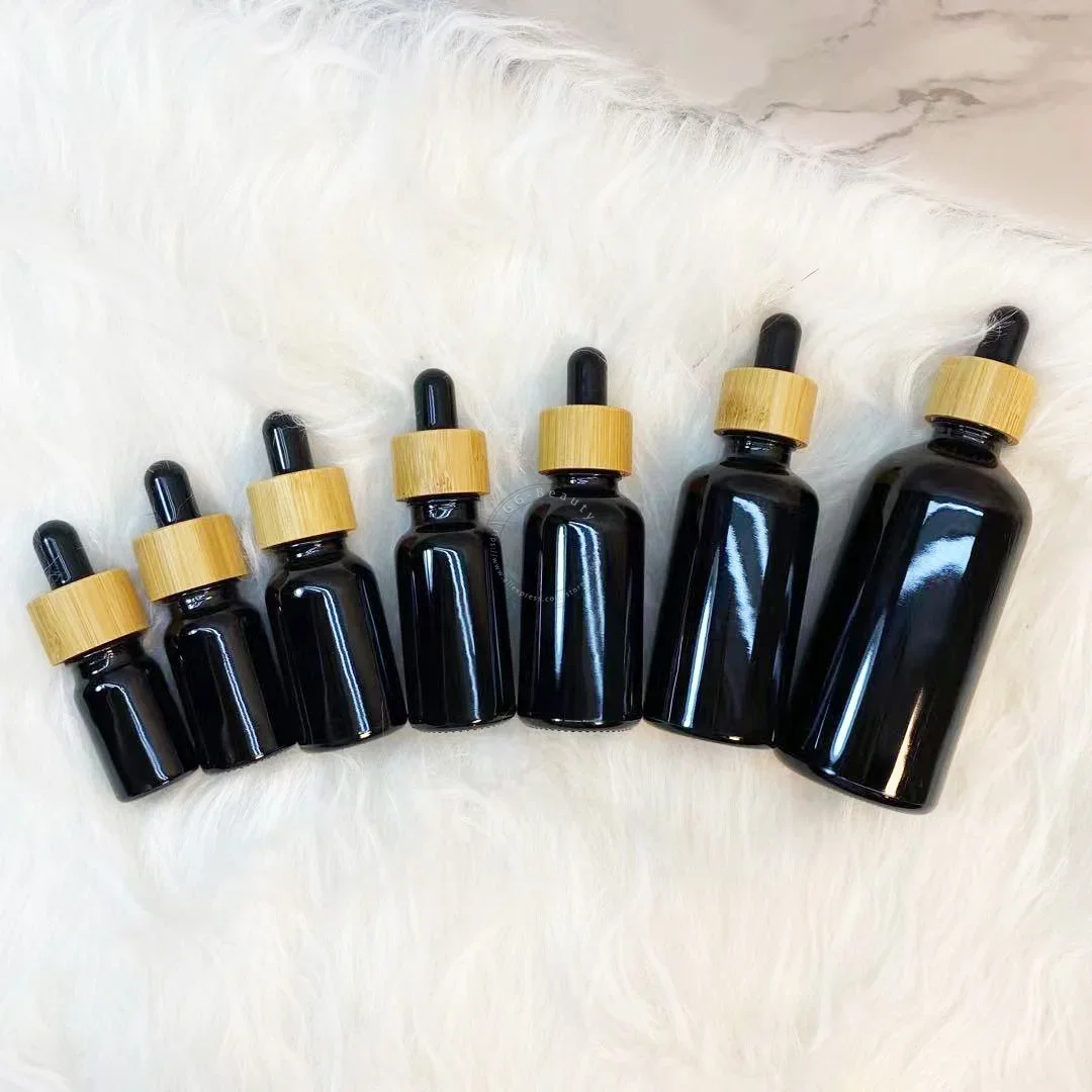 Whosesale frascos de garrafa conta-gotas de vidro âmbar/verde/azul/preto de alta qualidade com tampa de bambu pipeta para garrafas de perfumes cosméticos