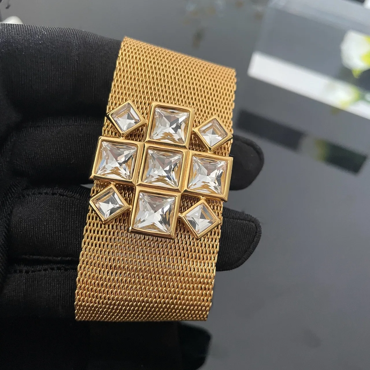 

European and American style diamond set wide edged geometric gold bracelet as a party accessory