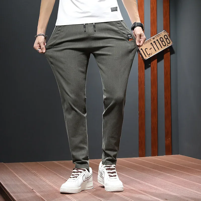 模造牛パンツ男性春と秋のトレンドストレートレッグパンツビジネスカジュアルパンツ男性成人紳士快適なルーズ