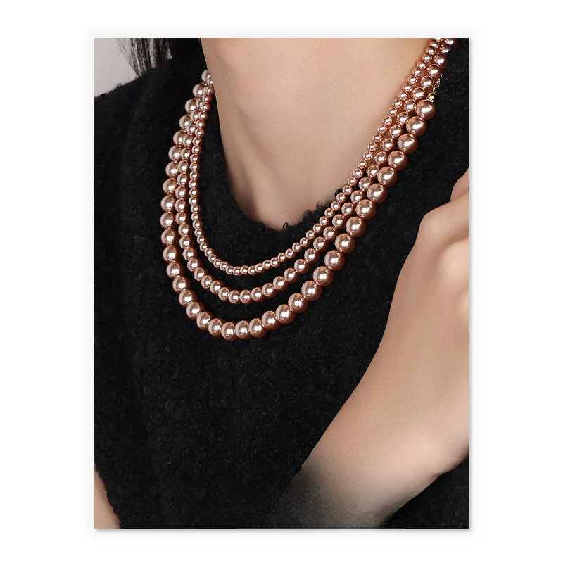 

Stacked design sense temperament sweet wind tahitian imitation pearl necklace sweater chain women