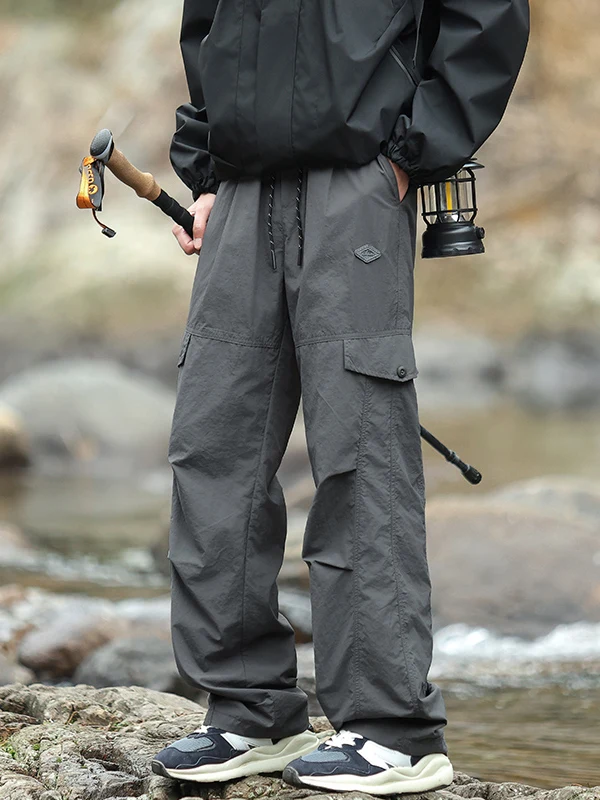 

Легкие летние рабочие брюки, мужские функциональные брюки для улицы, тихосохнущие свободные прямые брюки-джаты, спортивные повседневные брюки из ледяного шелка...